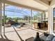 Screened lanai featuring a pool with waterfall feature, integrated spa, and outdoor kitchen at 18111 Diamond Cove Ct, Tampa, FL 33647