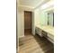Bathroom featuring an expansive vanity and storage cabinet at 1822 Lake Cypress Dr # 1822, Safety Harbor, FL 34695
