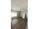 Bedroom with wood flooring, ceiling fan, and a bright window at 1822 Lake Cypress Dr # 1822, Safety Harbor, FL 34695