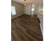 Spacious living room featuring lovely wood floors and a bright window with neutral paint at 1822 Lake Cypress Dr # 1822, Safety Harbor, FL 34695