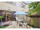 Charming back porch features outdoor furniture and a grill, perfect for relaxing and entertaining at 1881 N Hercules Ave # 1205, Clearwater, FL 33765