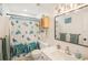 Clean bathroom with a shower curtain and vanity and modern fixtures at 1881 N Hercules Ave # 1205, Clearwater, FL 33765