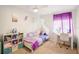 Charming bedroom featuring a themed bed, a bright window, and a play area at 1881 N Hercules Ave # 1205, Clearwater, FL 33765