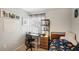 Cozy bedroom with a dedicated desk and chair, a storage shelf, and a comfortable sleeping area at 1881 N Hercules Ave # 1205, Clearwater, FL 33765