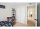Comfortable bedroom with a closet featuring a chair, and direct access to hallway at 1881 N Hercules Ave # 1205, Clearwater, FL 33765