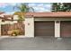 Private garage with easy access and ample parking, complemented by lush landscaping at 1881 N Hercules Ave # 1205, Clearwater, FL 33765