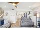 Comfortable living room featuring seating, stairs to the 2nd floor, and view into dining area at 1881 N Hercules Ave # 1205, Clearwater, FL 33765