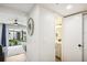 Bright living room featuring a view to the cozy outdoor patio and adjacent bathroom at 1881 N Hercules Ave # 1205, Clearwater, FL 33765
