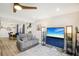 Cozy living room with comfortable seating, a modern entertainment center, and views to the dining area at 1881 N Hercules Ave # 1205, Clearwater, FL 33765