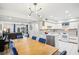 Open living space combining a dining area and kitchen, with a view to the living room at 1881 N Hercules Ave # 1205, Clearwater, FL 33765