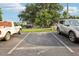 Open parking lot with several vehicles parked, including a Pool Service company truck in the parking area at 1881 N Hercules Ave # 1205, Clearwater, FL 33765