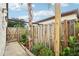 Enclosed side yard features mature trees and a privacy fence at 1881 N Hercules Ave # 1205, Clearwater, FL 33765