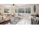 Bonus room featuring expansive windows and a work area, with tile flooring and views of the exterior landscape at 2022 Heathfield Cir, Sun City Center, FL 33573