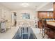 This lovely dining area features a decorative rug and transitions seamlessly to the bright kitchen at 2022 Heathfield Cir, Sun City Center, FL 33573