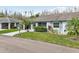 Charming single-story home with a well-maintained lawn and mature landscaping at 2022 Heathfield Cir, Sun City Center, FL 33573