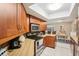 Well-maintained kitchen area features a sun tunnel, wood cabinets, and stainless steel appliances at 2022 Heathfield Cir, Sun City Center, FL 33573