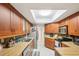 This kitchen offers ample counter space, stainless steel appliances, and a sun tunnel for natural lighting at 2022 Heathfield Cir, Sun City Center, FL 33573