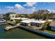 Aerial view of this waterfront home with a private pier and beautiful landscaping at 2240 Harbor View Dr, Dunedin, FL 34698