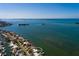 Breathtaking aerial view of a waterfront home with easy access to the bay and Gulf of Mexico at 2240 Harbor View Dr, Dunedin, FL 34698