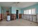 View of a bedroom being remodeled with light blue walls and a bathroom at 2240 Harbor View Dr, Dunedin, FL 34698