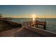 Beautiful sunset view from the private dock, offering a serene waterfront experience at 2240 Harbor View Dr, Dunedin, FL 34698