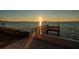 Beautiful sunset view from the private dock, offering a serene waterfront experience at 2240 Harbor View Dr, Dunedin, FL 34698