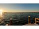 Beautiful sunset view from the private dock, overlooking the serene waterway at 2240 Harbor View Dr, Dunedin, FL 34698