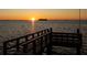 A pier with a bench overlooks the water at 2240 Harbor View Dr, Dunedin, FL 34698