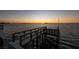 A shot of a pier at sunset at 2240 Harbor View Dr, Dunedin, FL 34698