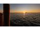 Gorgeous sunset over the tranquil water, showcasing the natural beauty of the waterfront location at 2240 Harbor View Dr, Dunedin, FL 34698
