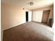Bedroom featuring natural light and a closet with sliding doors at 2449 Columbia Dr # 29, Clearwater, FL 33763