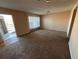 Inviting living room with outdoor access, neutral walls, and comfortable carpet flooring at 2449 Columbia Dr # 29, Clearwater, FL 33763
