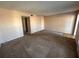 Cozy living room featuring neutral walls, carpet flooring, and a ceiling fan at 2449 Columbia Dr # 29, Clearwater, FL 33763
