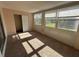 Sunroom filled with natural light and a closet with sliding glass doors at 2449 Columbia Dr # 29, Clearwater, FL 33763