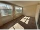 Sunroom filled with natural light from the wall of windows at 2449 Columbia Dr # 29, Clearwater, FL 33763