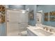 Bathroom with walk-in shower and a single sink with marble countertop at 29444 Toricelli Rd, Wesley Chapel, FL 33543