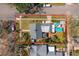 An aerial view shows home boundaries and highlights the backyard's amenities, like a deck and hot tub at 2951 7Th N Ave, St Petersburg, FL 33713