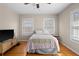 Bedroom featuring hardwood floors, a ceiling fan, and windows with blinds at 2951 7Th N Ave, St Petersburg, FL 33713