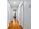 Hallway with wood floors and doors and frames painted bright white at 2951 7Th N Ave, St Petersburg, FL 33713