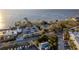 Coastal aerial shot including parking, tennis courts, and a distant ocean view at 3025 Bermuda Sloop Cir, Ruskin, FL 33570