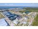 Stunning aerial view of waterfront community, featuring a marina, condos, and beautiful landscaping at 3025 Bermuda Sloop Cir, Ruskin, FL 33570