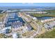 Waterfront community aerial showing marina, attached condos and homes, as well as lush landscaping at 3025 Bermuda Sloop Cir, Ruskin, FL 33570