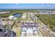 Aerial view of neighborhood featuring manicured lawns, waterfront property, and scenic views at 3025 Bermuda Sloop Cir, Ruskin, FL 33570