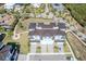 Breathtaking aerial view of a three-story townhome community with lush landscaping and a serene setting at 3025 Bermuda Sloop Cir, Ruskin, FL 33570