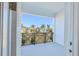 Private balcony overlooking a neighborhood with palm trees at 3025 Bermuda Sloop Cir, Ruskin, FL 33570