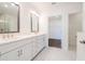 Bathroom features a double vanity with marble countertops at 3025 Bermuda Sloop Cir, Ruskin, FL 33570