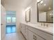 Bathroom features a double vanity with marble countertops at 3025 Bermuda Sloop Cir, Ruskin, FL 33570