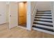 Interior view of residential elevator, stairs, and doorway at 3025 Bermuda Sloop Cir, Ruskin, FL 33570