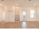 Bright entryway featuring a staircase, new wood-style tile floor and natural light at 3025 Bermuda Sloop Cir, Ruskin, FL 33570