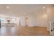 Bright open floor plan with wood-style tile flooring connects living space to the kitchen at 3025 Bermuda Sloop Cir, Ruskin, FL 33570